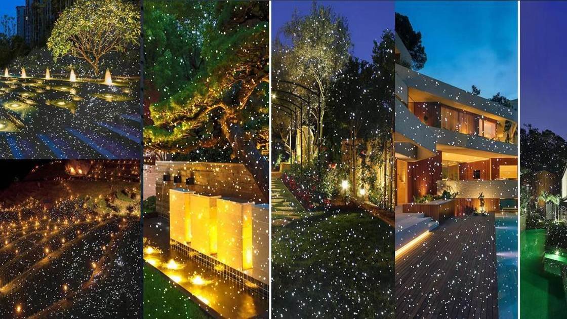 Outdoor decorative laser projector creating a firefly effect in a garden